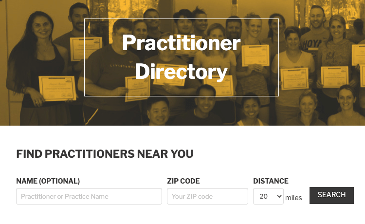 Image of a Heading "Practitioner Directory" with people holding course certificates in the background. Below the image, the form to search for practitioners near you is presented.